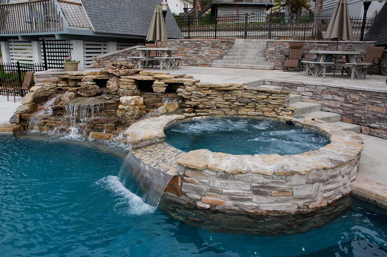 Large 9ft, jetted hot tub with cascading waterfall at Alpine Lodge Resort, Branson, Missouri.